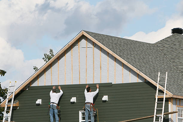 Professional Storm Damage Siding Repair technician working in Clemmons, NC
